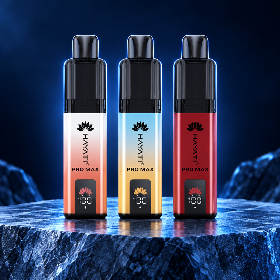 OXVA Xlim Pro 3 kits in champagne, blue and white, and black and gold on a navy studio plinth